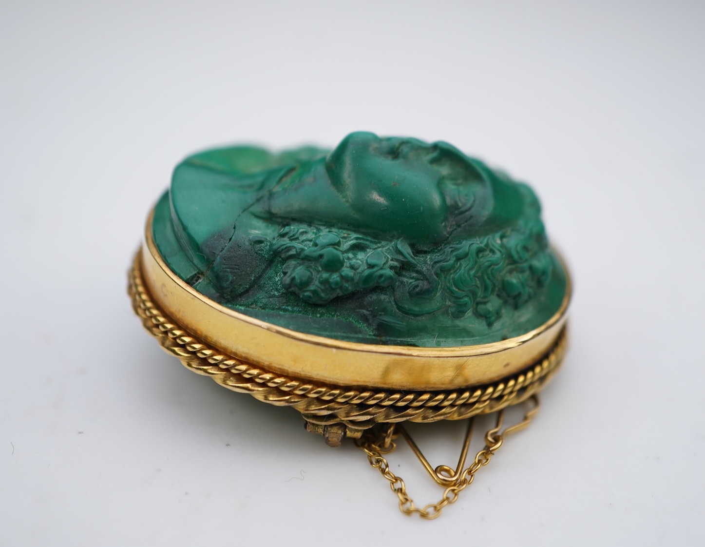 A malachite cameo brooch, mid 19th century